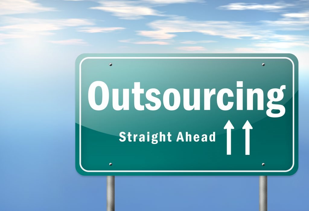 Highway Signpost "Outsourcing Straight Ahead"