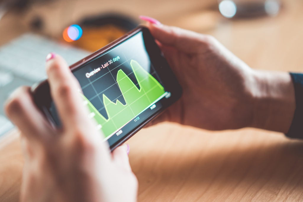 Young Woman Analyzing Website Traffic Earnings Chart On Iphone Picjumbo Com